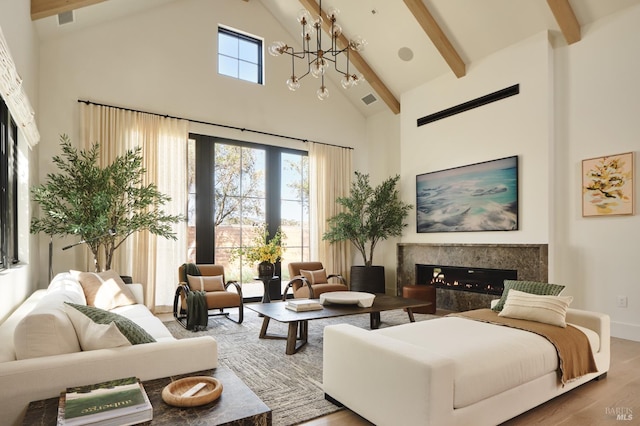 106 Vintners Ct, Napa, CA 94559 - living area with high vaulted ceiling, a high end fireplace, beamed ceiling, wood finished floors, and a chandelier