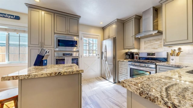 418 W Cotati Ave, Cotati, CA 94931 - kitchen featuring appliances with stainless steel finishes, wall chimney exhaust hood, gray cabinets, light stone counters, and decorative backsplash