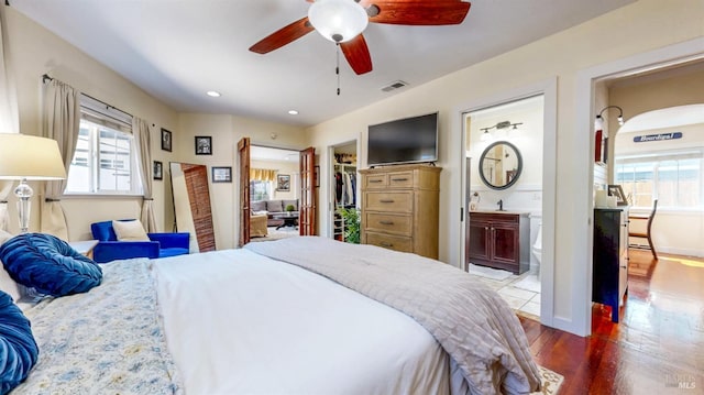 418 W Cotati Ave, Cotati, CA 94931 - bedroom with wood finished floors, a spacious closet, connected bathroom, ceiling fan, and recessed lighting