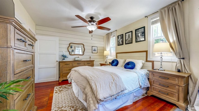 418 W Cotati Ave, Cotati, CA 94931 - bedroom with dark wood-style floors, wood walls, and ceiling fan