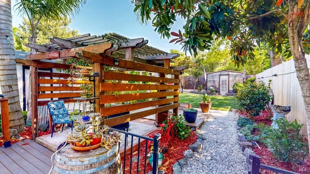 418 W Cotati Ave, Cotati, CA 94931 - fenced backyard featuring a wooden deck, a pergola, and a storage shed