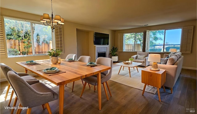 27 Via La Morra, American Canyon, CA 94503 - dining space featuring a tile fireplace, a chandelier, and dark wood-type flooring