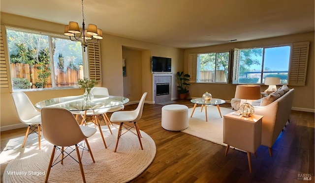 27 Via La Morra, American Canyon, CA 94503 - dining space with a tiled fireplace, wood finished floors, and a chandelier