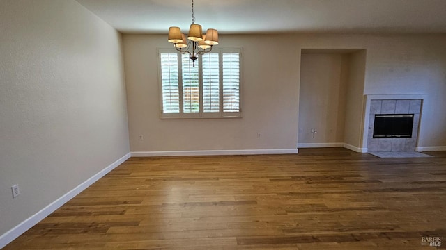 27 Via La Morra, American Canyon, CA 94503 - unfurnished dining area with a chandelier, wood finished floors, and a fireplace