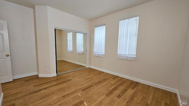 27 Via La Morra, American Canyon, CA 94503 - unfurnished bedroom with light wood-style flooring, a closet, and multiple windows