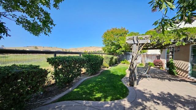 27 Via La Morra, American Canyon, CA 94503 - fenced backyard with a mountain view and a patio area