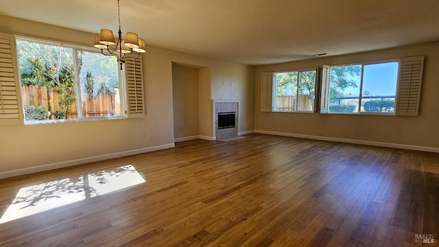 27 Via La Morra, American Canyon, CA 94503 - unfurnished living room with a chandelier, wood finished floors, and a tiled fireplace