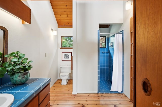 10 Miwok Way, Inverness, CA 94937 - bathroom with vanity, hardwood / wood-style floors, tiled shower, lofted ceiling, and wooden ceiling