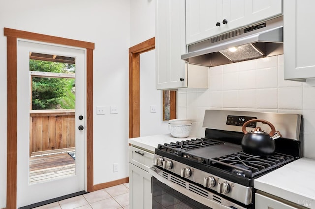 10 Miwok Way, Inverness, CA 94937 - kitchen featuring stainless steel range with gas stovetop, under cabinet range hood, decorative backsplash, light countertops, and light tile patterned floors