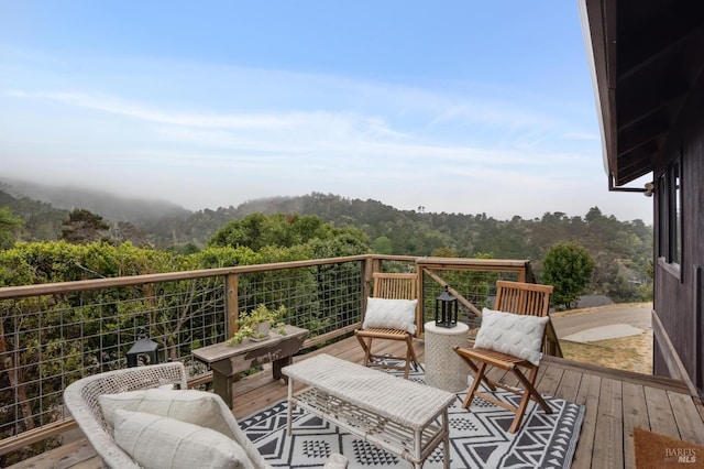 10 Miwok Way, Inverness, CA 94937 - view of wooden balcony with a wooded view and a deck
