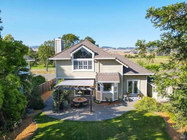 2128 Saint Augustine Cir, Petaluma, CA 94954 - back of property with a chimney, a patio, and french doors
