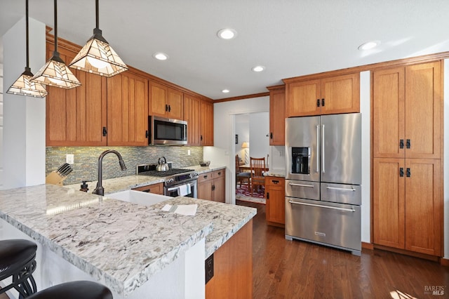 2128 Saint Augustine Cir, Petaluma, CA 94954 - kitchen featuring stainless steel appliances, a peninsula, backsplash, brown cabinets, and recessed lighting
