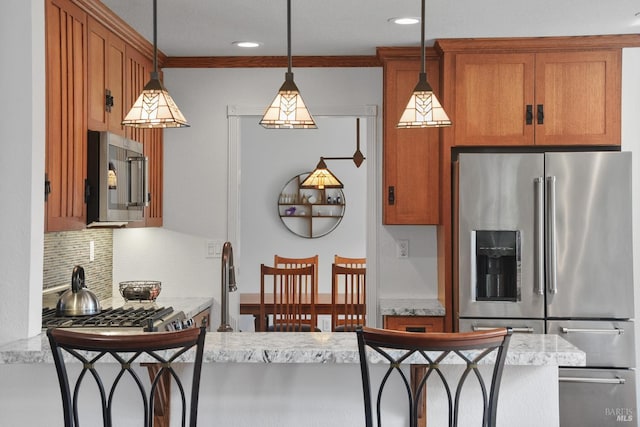 2128 Saint Augustine Cir, Petaluma, CA 94954 - kitchen with stainless steel appliances, backsplash, brown cabinets, hanging light fixtures, and recessed lighting
