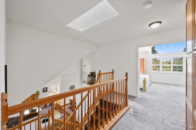 2128 Saint Augustine Cir, Petaluma, CA 94954 - hallway featuring an upstairs landing, light colored carpet, and a skylight