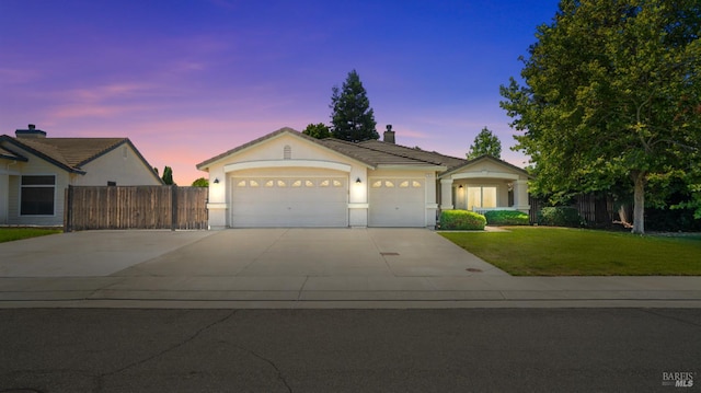 705 Wiegand Way, Dixon, CA 95620 - ranch-style home with concrete driveway, a garage, stucco siding, a chimney, and a tiled roof