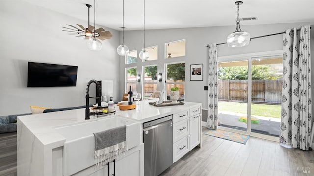705 Wiegand Way, Dixon, CA 95620 - kitchen with dishwasher, open floor plan, white cabinetry, hanging light fixtures, and light wood-style floors