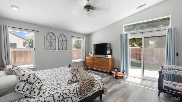 705 Wiegand Way, Dixon, CA 95620 - bedroom featuring vaulted ceiling, access to outside, wood finished floors, multiple windows, and a ceiling fan