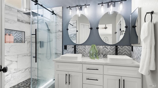 705 Wiegand Way, Dixon, CA 95620 - bathroom featuring a marble finish shower, double vanity, and tile walls