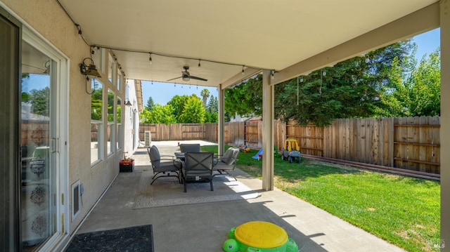 705 Wiegand Way, Dixon, CA 95620 - fenced backyard featuring outdoor dining space, a patio, and a ceiling fan
