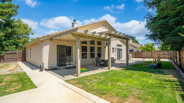 705 Wiegand Way, Dixon, CA 95620 - rear view of house with a chimney, stucco siding, a fenced backyard, and a patio