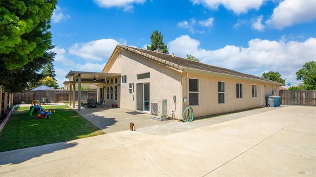 705 Wiegand Way, Dixon, CA 95620 - rear view of house with a patio, a fenced backyard, and stucco siding