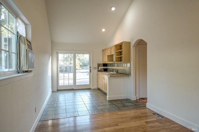 1221 Apple Tree Ct, Sonoma, CA 95476 - kitchen with open shelves, arched walkways, tasteful backsplash, wood finished floors, and recessed lighting