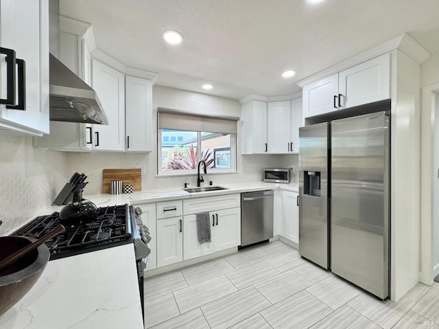 2300 W Park Ave, Napa, CA 94558 - kitchen featuring stainless steel appliances, white cabinets, recessed lighting, backsplash, and wall chimney range hood