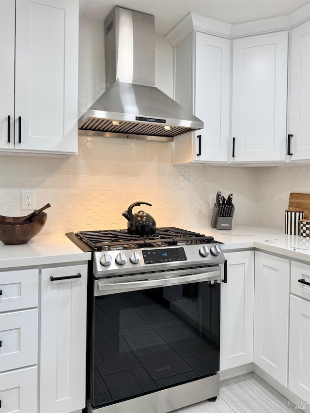 2300 W Park Ave, Napa, CA 94558 - kitchen featuring wall chimney range hood, stainless steel range with gas stovetop, light countertops, and white cabinetry