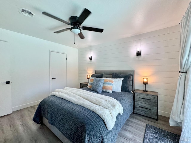 2300 W Park Ave, Napa, CA 94558 - bedroom featuring wood finished floors, ceiling fan, and wooden walls