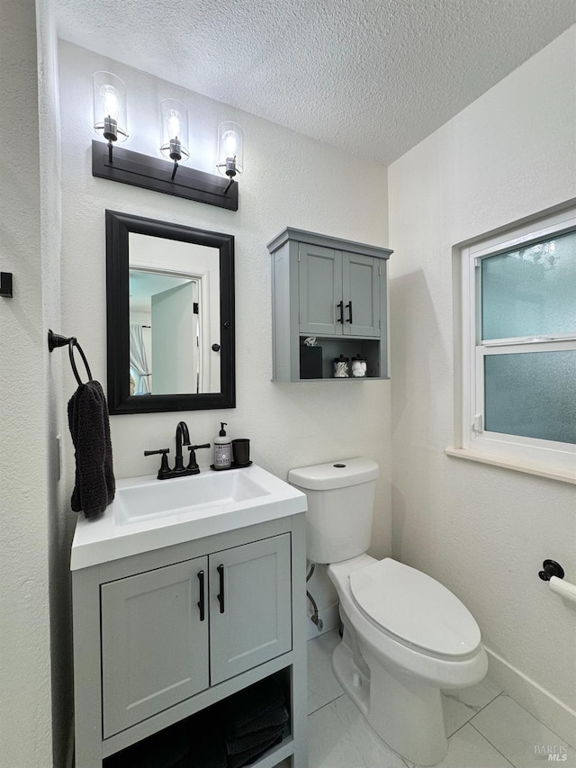 2300 W Park Ave, Napa, CA 94558 - half bathroom with vanity, a textured ceiling, and marble look tile flooring