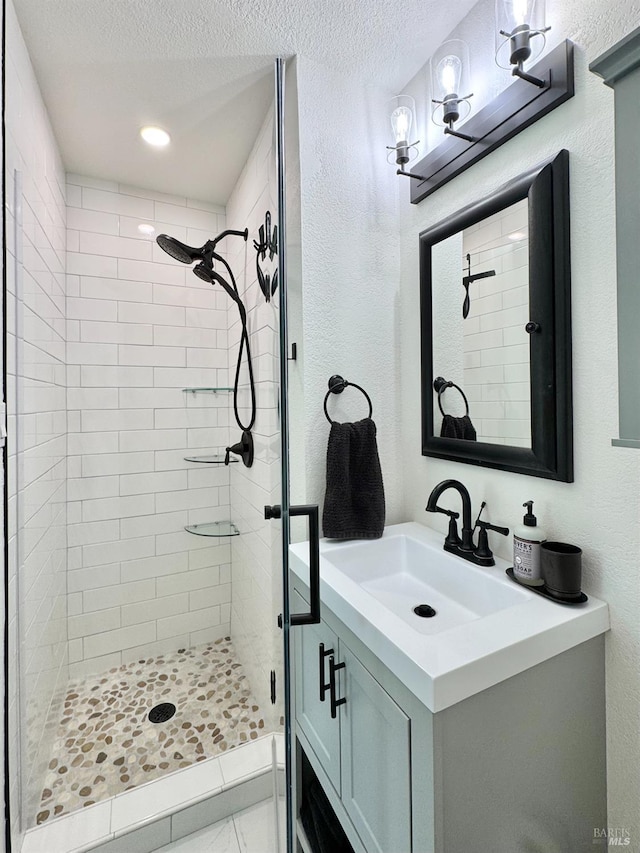 2300 W Park Ave, Napa, CA 94558 - bathroom with a shower stall, vanity, a textured ceiling, and a textured wall