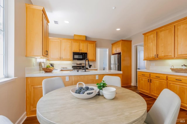 339 Sterling Way, San Rafael, CA 94903 - kitchen with black microwave, freestanding refrigerator, dark wood-type flooring, light countertops, and recessed lighting