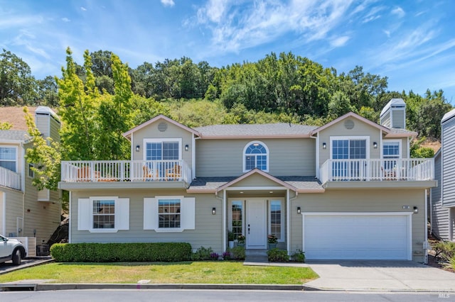 339 Sterling Way, San Rafael, CA 94903 - view of front facade with a balcony, driveway, a garage, a front lawn, and roof with shingles