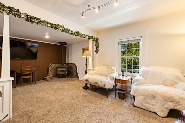 9748 Middle Creek Rd, Upper Lake, CA 95485 - living area with a wood stove, carpet floors, and ornamental molding