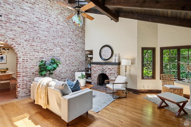 7 Shanley Ln, Ross, CA 94957 - living area featuring high vaulted ceiling, a wood ceiling with exposed beams, a brick fireplace, wood finished floors, and ceiling fan