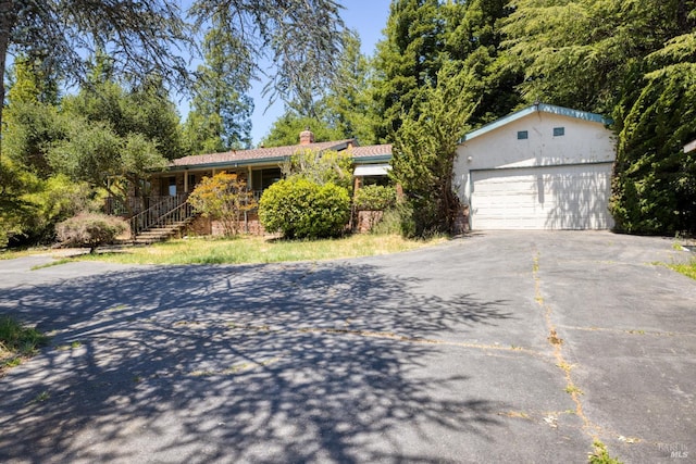 1415 Schaeffer Rd, Sebastopol, CA 95472 - ranch-style house with a chimney and driveway