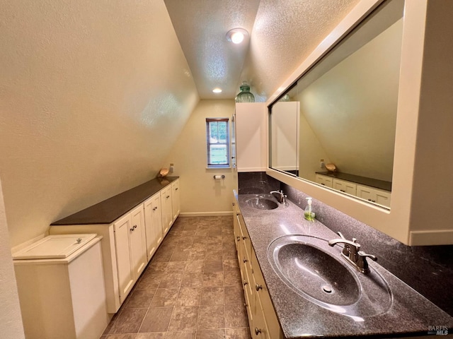 436 S Front St, Rio Vista, CA 94571 - full bath featuring lofted ceiling, a textured ceiling, and double vanity