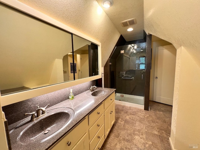 436 S Front St, Rio Vista, CA 94571 - full bath featuring a stall shower, double vanity, a textured ceiling, and a textured wall