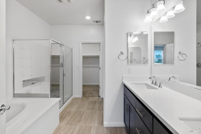 40708 Fremont Blvd, Fremont, CA 94538 - bathroom with a shower stall, double vanity, a bath, and a walk in closet