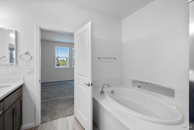 40708 Fremont Blvd, Fremont, CA 94538 - full bath with vanity, a garden tub, and wood finished floors