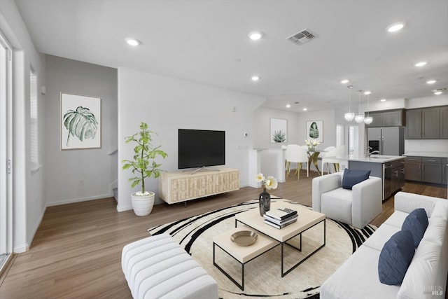 40708 Fremont Blvd, Fremont, CA 94538 - living area with light wood-type flooring and recessed lighting