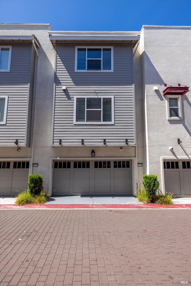 40708 Fremont Blvd, Fremont, CA 94538 - view of front facade with a garage, driveway, and stucco siding