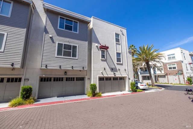 40708 Fremont Blvd, Fremont, CA 94538 - multi unit property featuring an attached garage, stucco siding, and a residential view