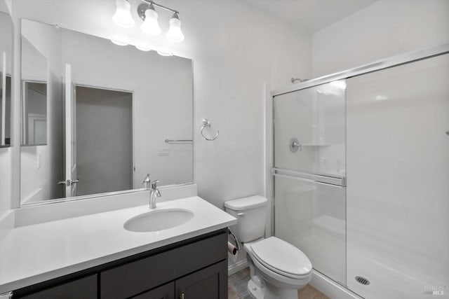 40708 Fremont Blvd, Fremont, CA 94538 - full bathroom featuring a stall shower, vanity, and wood finished floors