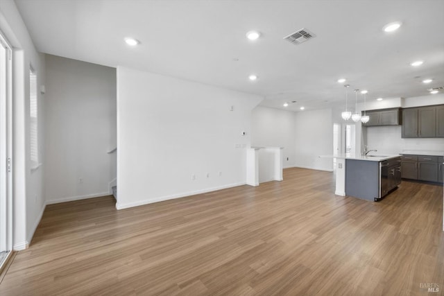 40708 Fremont Blvd, Fremont, CA 94538 - unfurnished living room featuring light wood-type flooring and recessed lighting