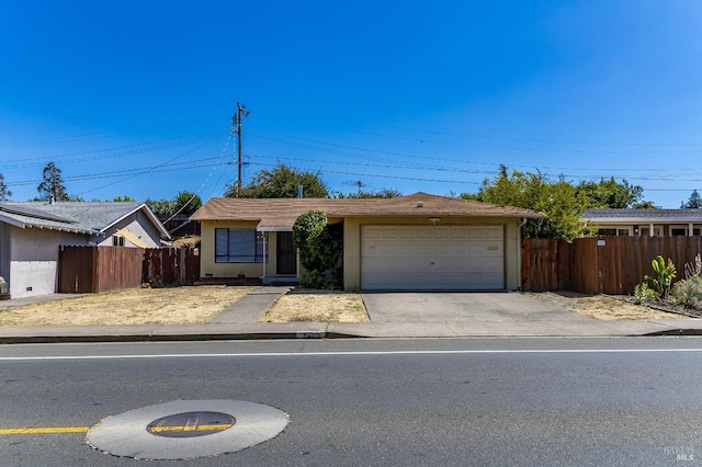 1255 Sereno Dr, Vallejo, CA 94589 - ranch-style home with an attached garage, concrete driveway, and stucco siding