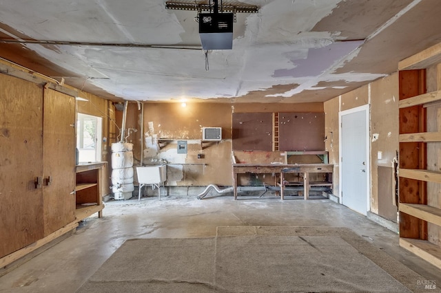 1255 Sereno Dr, Vallejo, CA 94589 - garage with a garage door opener, strapped water heater, a wall mounted air conditioner, and a workshop area