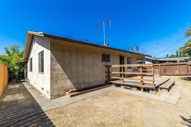 1255 Sereno Dr, Vallejo, CA 94589 - back of property with a deck, stucco siding, and a patio