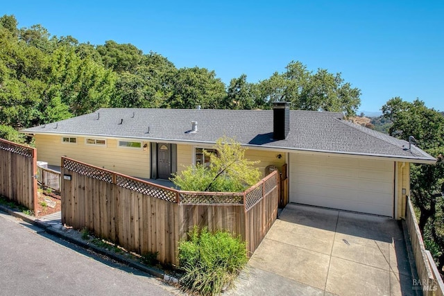 76 Oak Springs Dr, San Anselmo, CA 94960 - view of front of property with a chimney, an attached garage, and driveway
