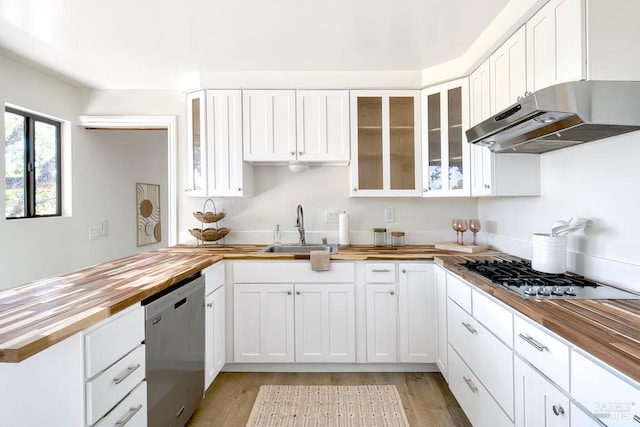 76 Oak Springs Dr, San Anselmo, CA 94960 - kitchen with butcher block counters, under cabinet range hood, stainless steel appliances, and a peninsula